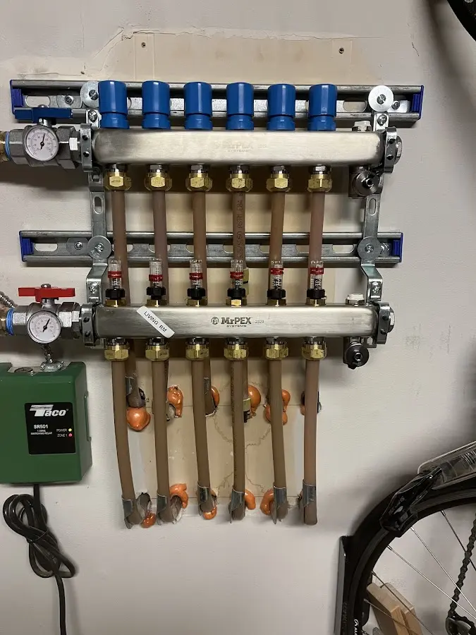 Plumber performing Water Heater Repair at a residential property in Saratoga Springs